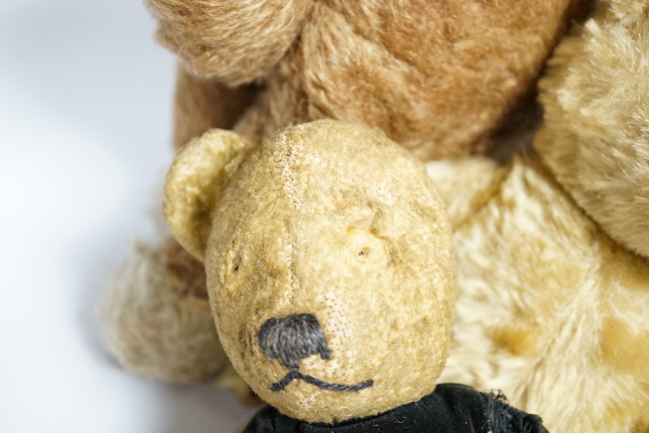 A Chad Valley teddy bear, 34cm high, a smaller bear in velvet clothes and a Merrythought horse